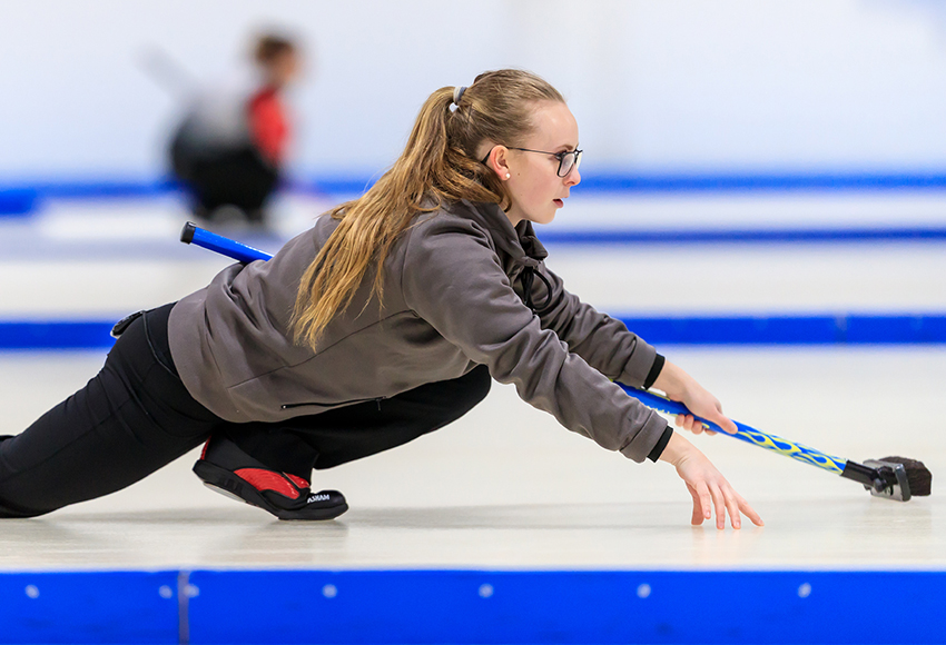 Third Erin Wells watches a shot during the ACAC Winter Regional at Avonair Curling Club last month. The Griffins are after the sixth ACAC women's championship in program history this weekend in Olds (Robert Antoniuk photo).