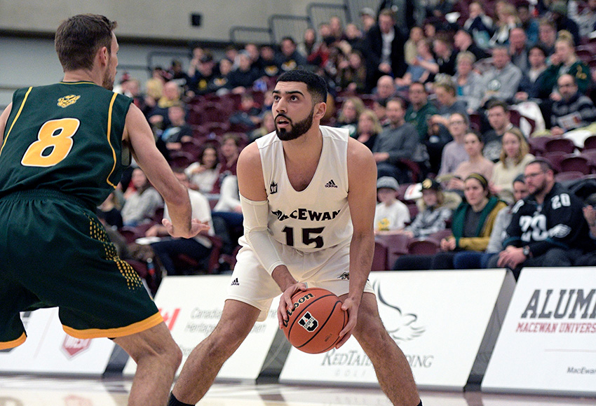 In front of a large White Out crowd at MacEwan's David Atkinson Gym, Ali Raza eyes up a shot on Alberta's Lyndon Annetts Thursday night (Chris Piggott photo).