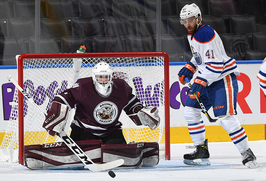 MacEwan goalie Marc-Olivier Daigle makes a save in front of Oilers' rookie Evan Polei on Wednesday night. Daigle and NAIT's Nathan Park combined for a 49-save shutout (Photo courtesy Edmonton Oilers).