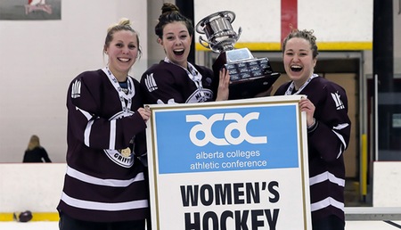 Griffins Courtney Zajac, left, Sydney Thomlison and Shanya Shwetz celebrate the 2016-17 ACAC women's hockey championship last March. On Oct. 6, before their 2017-18 home opener, MacEwan University will hold a special ceremony honouring their accomplishment (Nick Kuiper photo).