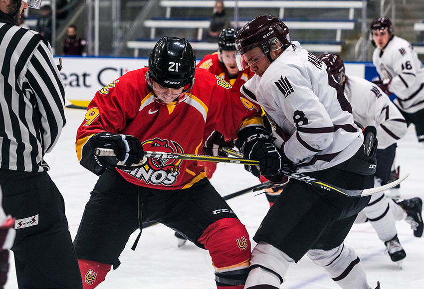 Garan Magnes, seen battling University of Calgary's Graham Black during a preseason game last month at the Downtown Community Arena, has hit the ground running with eight points in his first four ACAC games (Matthew Jacula photo).
