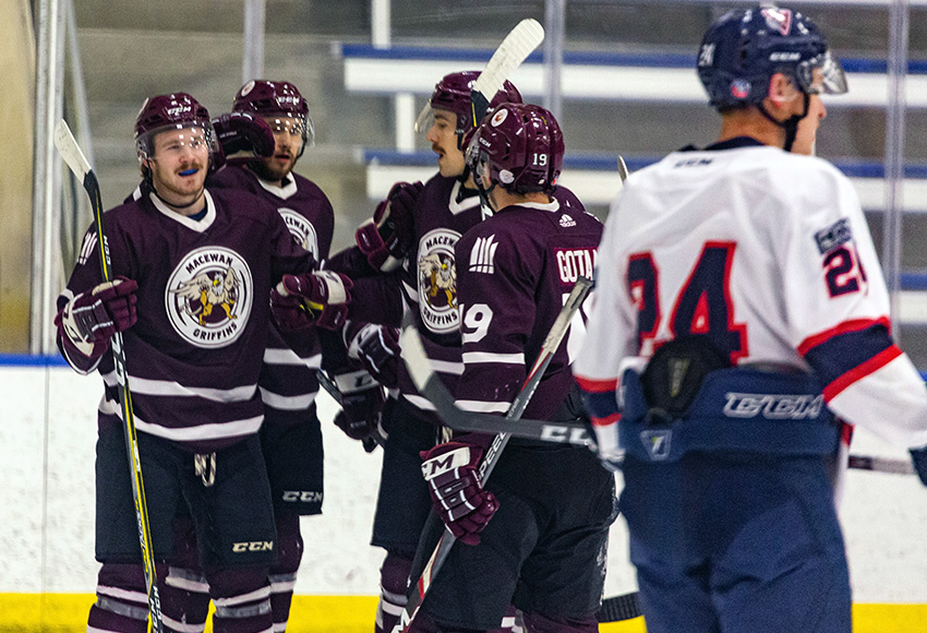 Payton McIsaac, left, celebrates his first ACAC goal with teammates, including setup man Cam Gotaas, right. Gotaas had a four-point night as MacEwan defeated Portage 8-1 Friday (Joel Kingston photography).
