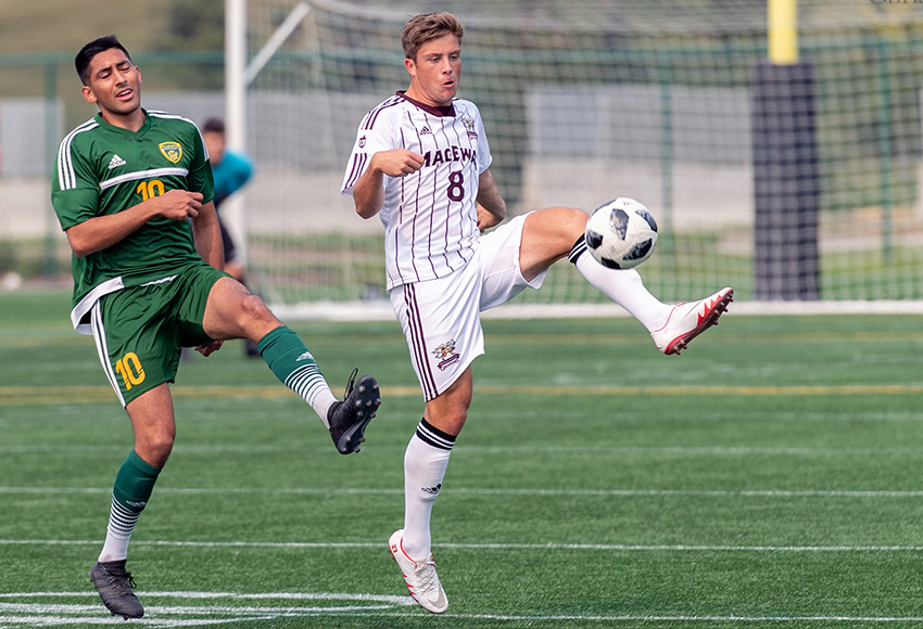 MacEwan's Zachary Rochat nets the ball ahead of Alberta's Ajeej Sarkaria in their season opener on Aug. 25. The Griffins will be looking for results during a two-game road trip to Lethbridge and Saskatchewan this weekend (Chris Piggott photo).