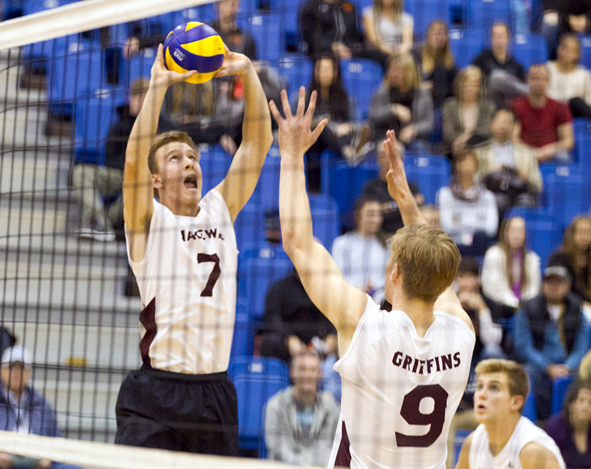 Setter Jonathan Mohler offers up a pass, while teammate Max Vriend waits in support against Thompson Rivers University on Friday night (Andrew Snucins photo).