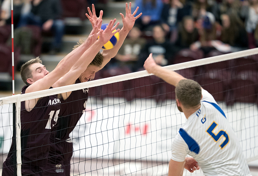 Ryan Zachary, left, and Max Vriend put up a double block against UBC-Okanagan's Lars Bornemann last weekend. In Saturday's 3-2 win over Manitoba, Zachary led the Griffins with 23 kills, while Vriend set a new school record with 12 blocks (Robert Antoniuk photo).