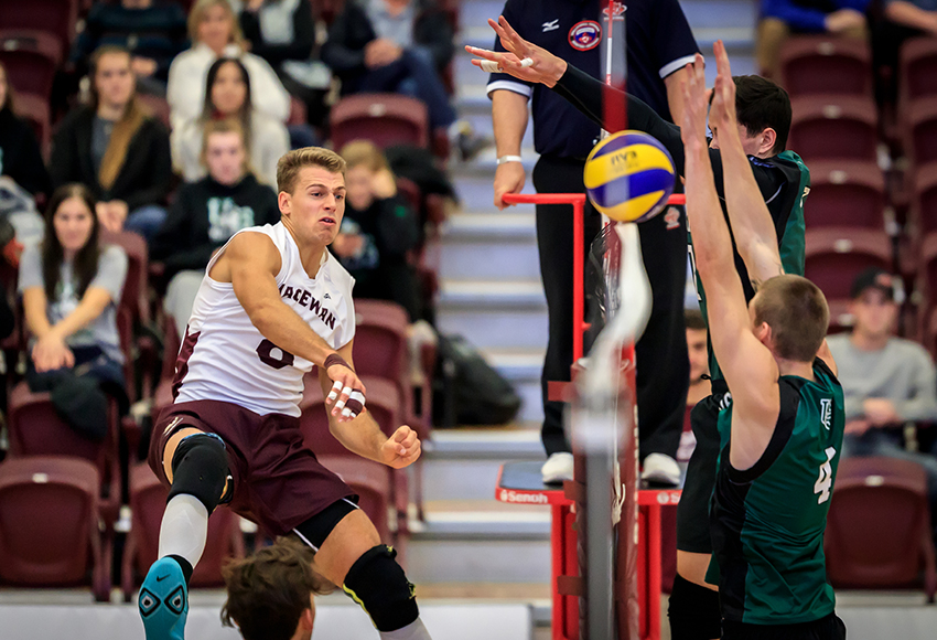 Kai Hesthammer hammers a kill past the Saskatchewan block during a match earlier this season. He will play the final home matches of his university career this weekend (Robert Antoniuk photo).