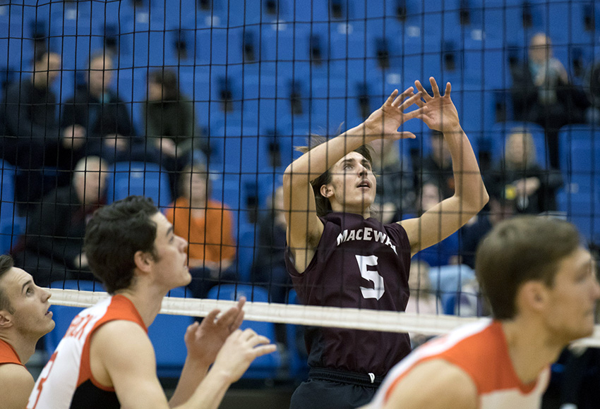 Caleb Weiss sets the ball against Thompson Rivers University on Saturday night in Kamloops, B.C. (Andrew Snucins photo).