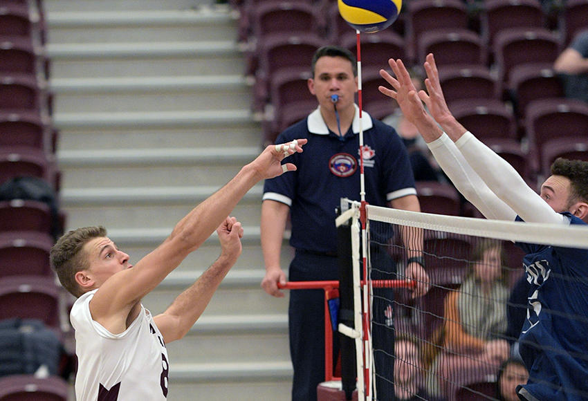 Kai Hesthammer battles at the net for a ball on Saturday night in the final home game of his distinguished four-year MacEwan career (Chris Piggott photo).