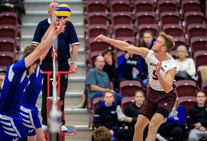 Max Vriend hammers a kill off the UBC-Okanagan block during a match last weekend. The Griffins are flying high after sweeping the Heat, aiming to keep the momentum going against Manitoba this weekend (Robert Antoniuk photo).