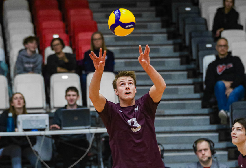 Alex Lyndon sets a ball on Saturday night. He had 25 assists and five aces, the latter breaking a program record (David Larkins photo).
