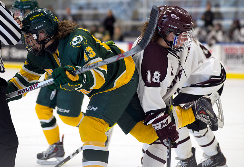 Morgan Casson battles Alberta Pandas' Amy Boucher during a preseason game in September. She scored her first two goals of the campaign on Thursday night against Olds after missing much of the early part of the season with an injury (Len Joudrey photo).