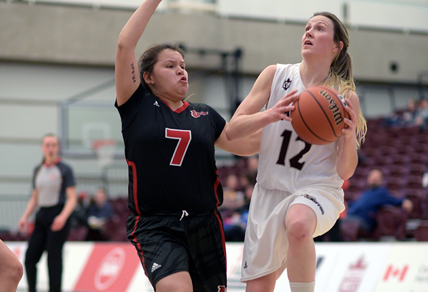 Kayla Ivicak drives past Winnipeg's Robyn Boulanger during Friday's contest. She led the Griffins with 20 points and 18 rebounds (Chris Piggott photo).