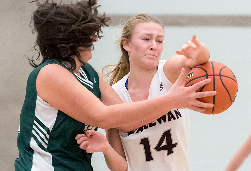 Shannon Majeau blocks a pass attempt from UNBC's Vasiliki Louka during a game last November. That matchup was the defensive highlight of her university career to date as she held the Canada West second team all-star to single digits in points on back-to-back nights (Chris Piggott photo).
