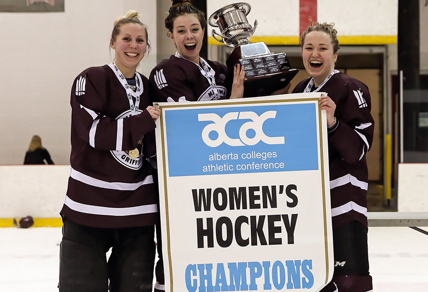 Courtney Zajac, left, Sydney Thomlison and Shanya Shwetz pose with the trophy and banner after knocking off the SAIT Trojans last March to claim the Griffins' first ACAC Championship since 2008 (Nick Kuiper photo).