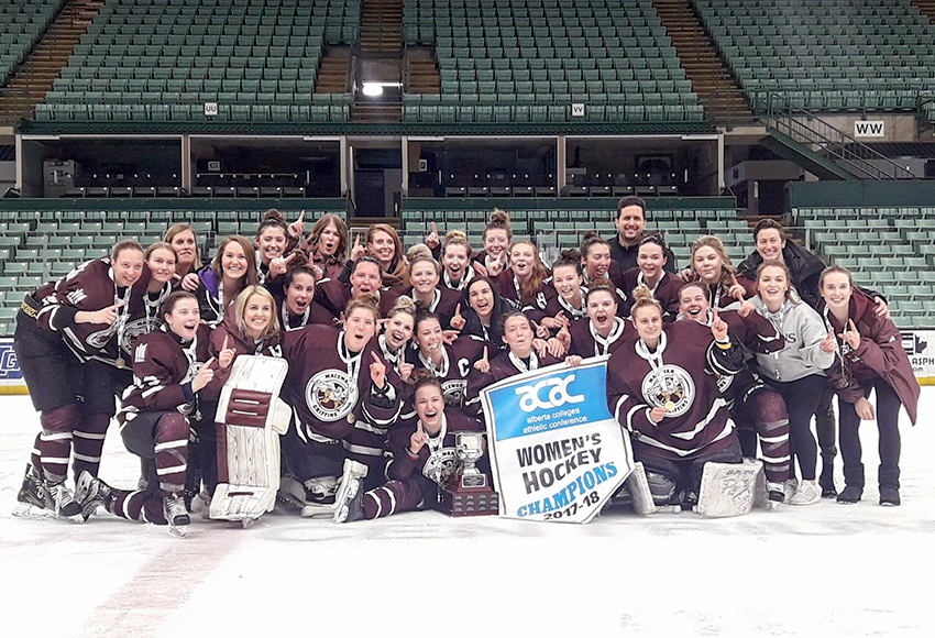 The MacEwan Griffins celebrate with the 2017-18 ACAC women's hockey banner at the Enmax Centrium in Red Deer on Friday night (RDC Athletics photo).