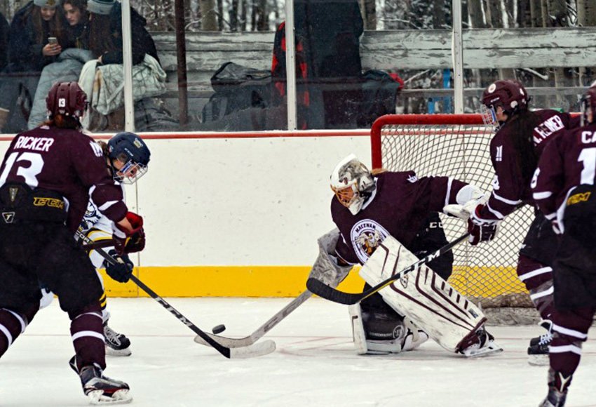 Sandy Heim makes one of her 27 saves in Saturday's Falun Frozen Female Challenge. MacEwan lost 1-0 in double overtime (Byron Weaver, NAIT Athletics).