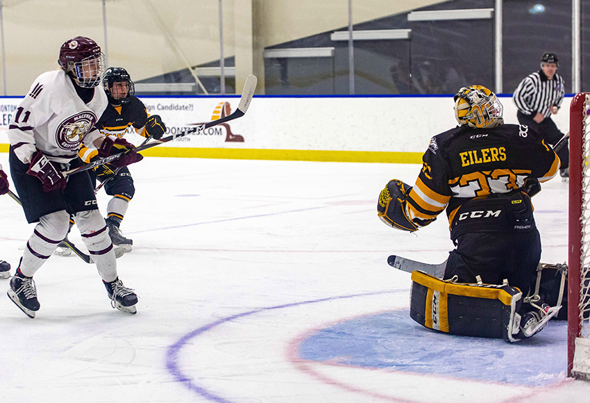 Amanda Murray scores the opening goal of the game past Olds goalie Victoria Eilers on Saturday night (Joel Kingston photo).