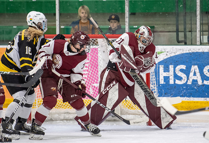 Brianna Sank, seen making a save on Friday against Saskatchewan, stopped 64 of 67 shots thrown her way on the weekend (Electric Umbrella photo).
