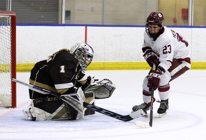 Mila Verbicky gets a golden chance in tight on Manitoba's Emily Shippam. Verbicky scored MacEwan's opening goal on a bar-down snipe (James Maclennan photo).