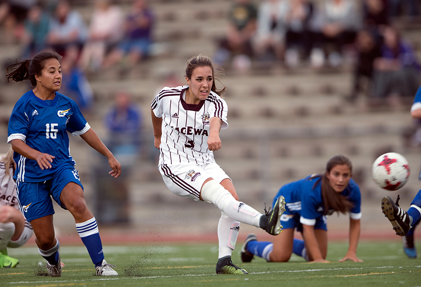 Brittany Costa scores the opening goal bar-down in the 22nd minute on Friday night. She later added an assist in MacEwan's 3-0 victory (Robert Antoniuk photo).