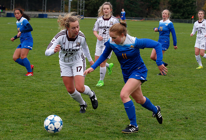MacEwan's Sarah Riddle goes after the ball against Victoria's Caitlin Millham on Friday (Courtesy Trinity Western).