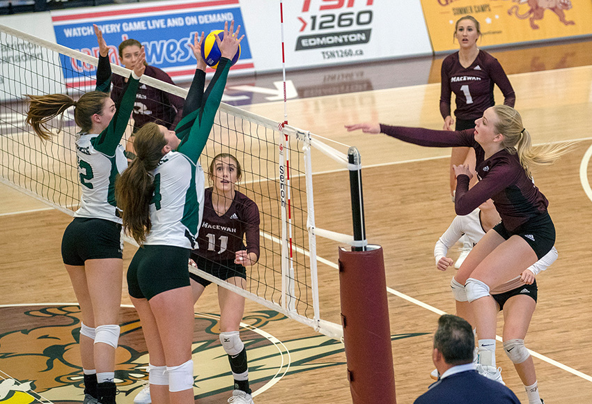 Hailey Cornelis hammers one from the left side for the Griffins on Saturday. She and Janna Ogle, #1 background, came up big for MacEwan in a 3-1 win (Eduardo Perez photo).