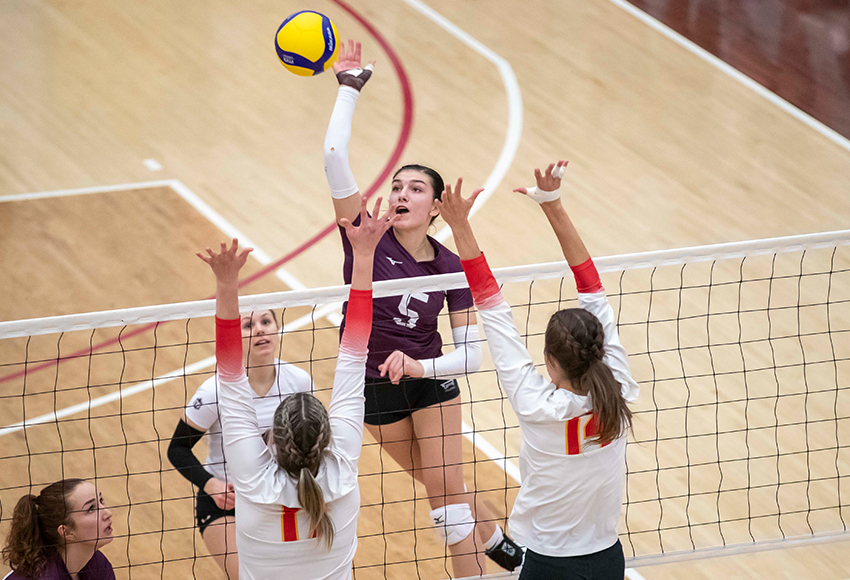 Mariah Bereziuk hits against the Calgary Dinos on Saturday. She led the Griffins with 12 kills and five digs (Eduardo Perez photo).