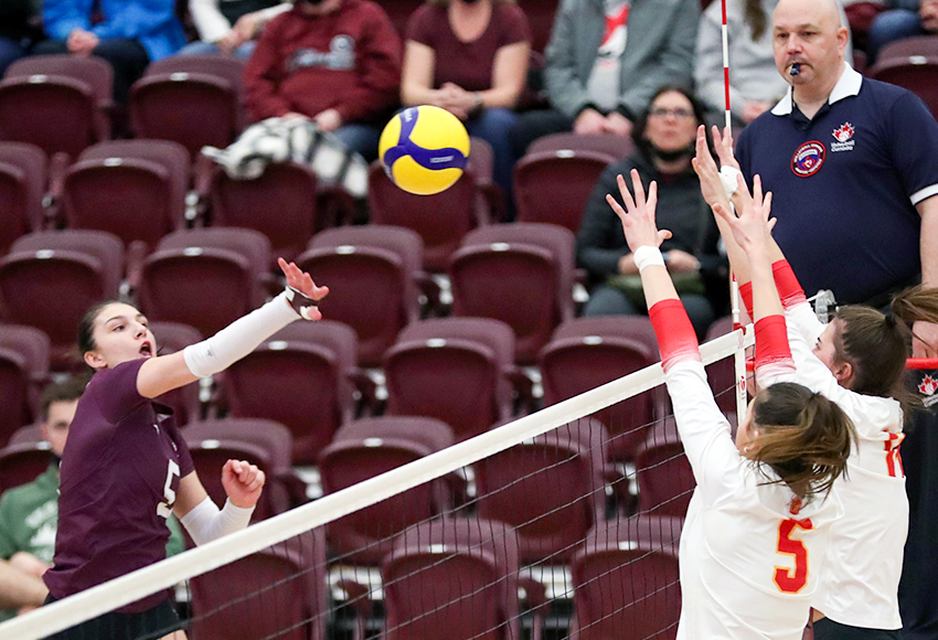 Mariah Bereziuk attacks the Dinos' block on Saturday. She led the Griffins with 14 kills in a huge 3-2 win (Eduardo Perez photo).