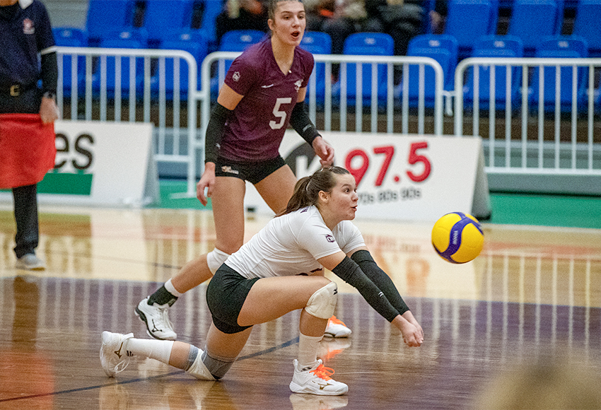 Bronwyn Ettinger digs out a ball with Mariah Bereziuk looking on Friday (Andrew Snucins photo).