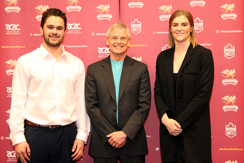Griffins athletes of the year Brett Njaa (men's hockey), left, and Cassidy Kinsella (women's volleyball), right, pose with MacEwan University Vice-President Academic and Provost John Corlett at the Sutton Place Hotel on Thursday (Ryan Gurnett photo).