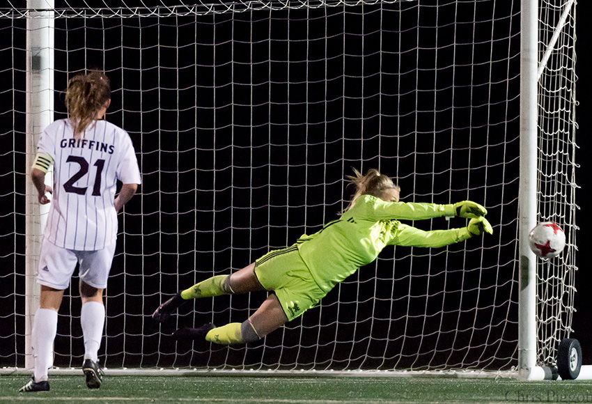 Griffins women's soccer goalkeeper Emily Burns dives to stop a shot from Alberta;s Morgan Burnett in the 53rd minute last Friday. She posted back-to-back shutouts to help keep MacEwan undefeated (Chris Piggott photo).