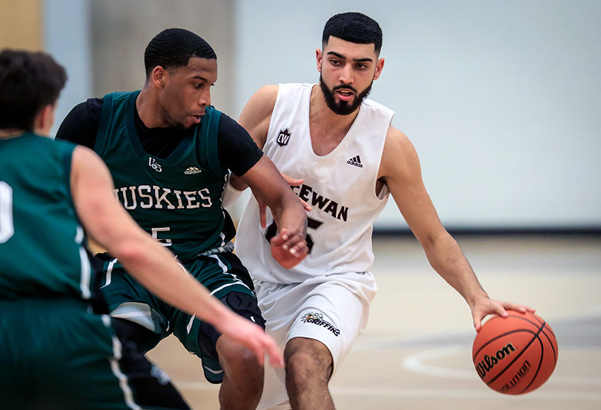 Ali Raza moves the ball against Saskatchewan's Lawrence Moore on Friday. He was the driving force behind MacEwan's late game charge to win the contest 101-83 (Robert Antoniuk photo).