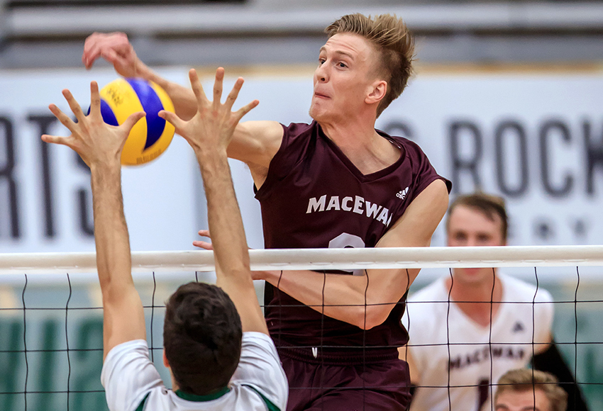Max Vriend blasts down a kill in a match earlier this season. He had a record-setting performance with 12 blocks against Manitoba last Saturday (Robert Antoniuk photo).