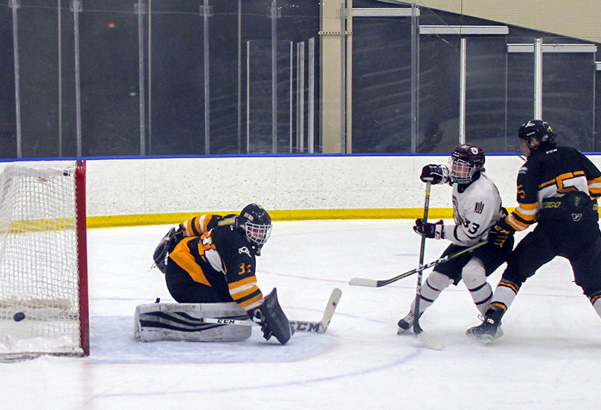Shyla Jans gets a chance in close on Olds goalie Lexi Bruce Saturday. She had a goal and an assist in a 4-2 win at home on Saturday (Melbourne Disbrow photo).