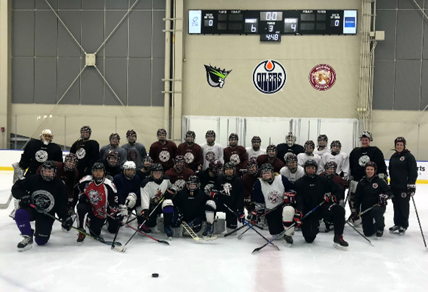 MacEwan women's hockey players pose with the 'Griffin for a Day' participants last season. This year's edition, running Nov. 25, will feature both boys and girls hockey players from various communities around Alberta (Photo courtesy of Shyla Jans).