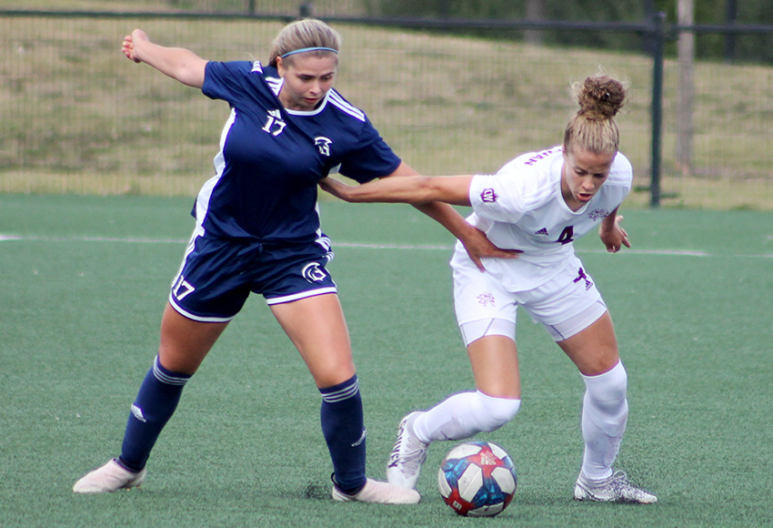 Samantha Gouveia, right, seen in action against Trinity Western in preseason, scored twice and delivered back-to-back outstanding defensive efforts as the Griffins won twice on the weekend (Jefferson Hagen photo).