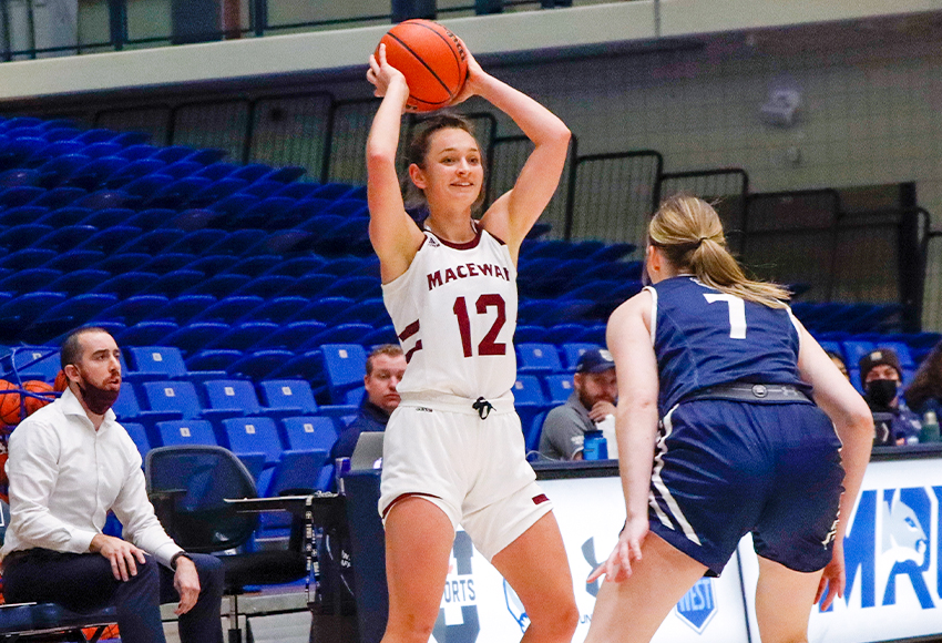 Noelle Kilbreath looks to pass against Mount Royal University last Saturday. She scored 33 points over two games in a weekend split (Ellery Platts photo).