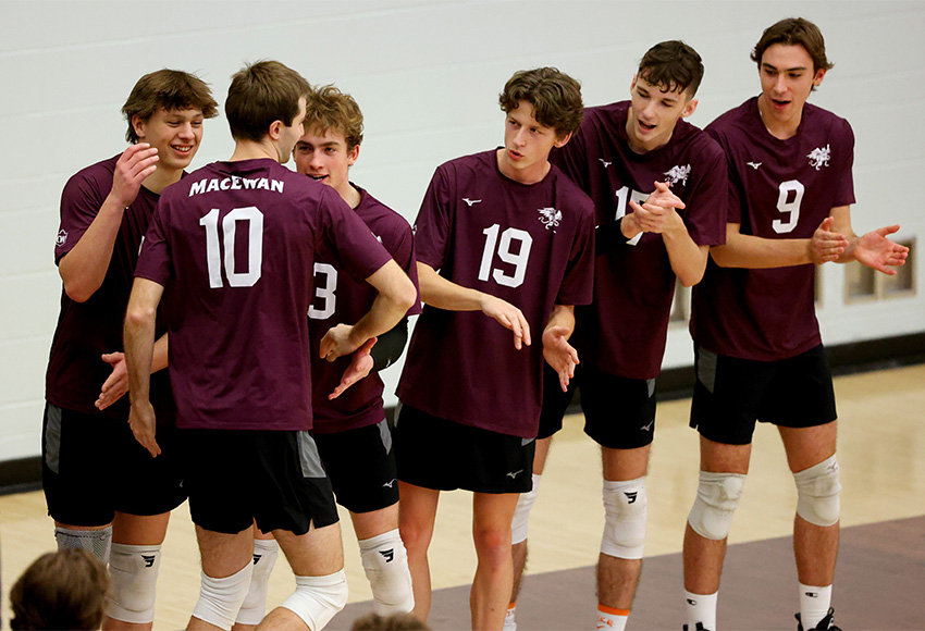 Griffins men's volleyball players welcome Seth Birkholz to the court against Alberta last weekend. They'll host Winnipeg this weekend (James Maclennan photo).