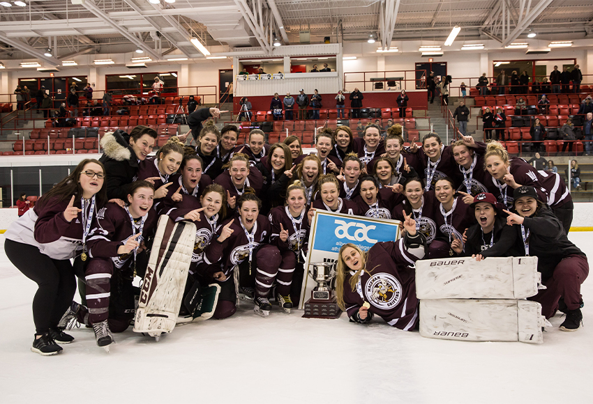 The Griffins women's hockey team celebrates their first of three-straight ACAC Championships from 2017-19. Many players are returning to MacEwan for alumni games on Dec. 7 (Nick Kuiper photo).