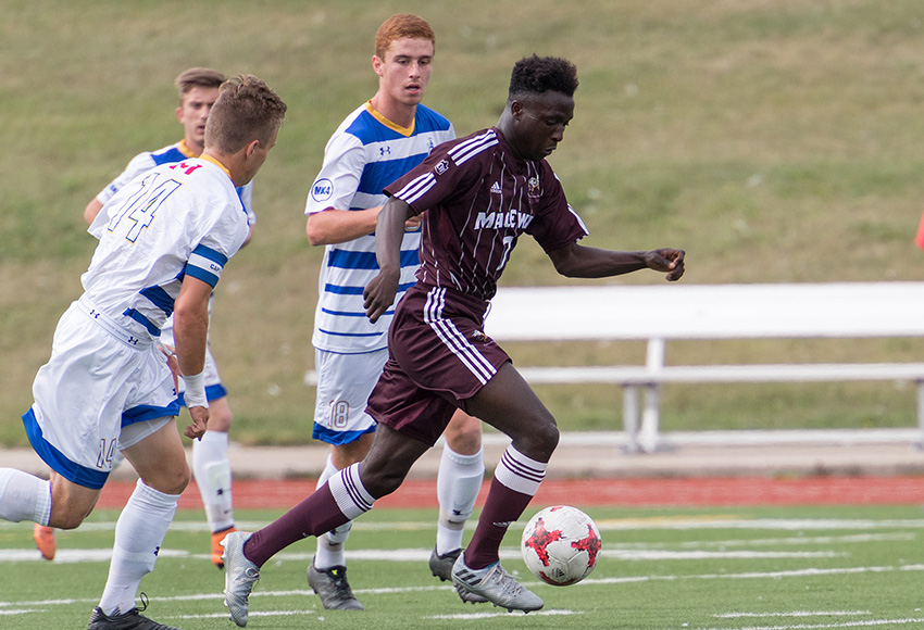 MacEwan's Lahai Mansaray streaks through the Lethbridge defence on Sept. 3. Mansaray leads the Griffins in scoring with three goals. The Griffins visit Victoria and UBC this weekend (Chris Piggott photo).