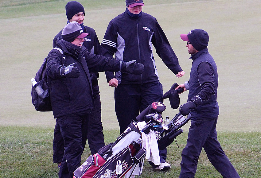 Assistant coach Alan Riley, left, and Griffins teammates greet Justin Berget after he wrapped up a nine-shot win for the ACAC men's individual title on Sunday at Coal Creek Golf Resort (Brody Mark photo, Courtesy SAIT Athletics).
