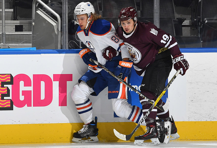 MacEwan's Cam Gotaas, seen battling with Edmonton Oilers rookie William Lagesson during their match at Rogers Place last month, will serve as one of the Griffins' assistant captains this season (Courtesy, Edmonton Oilers).