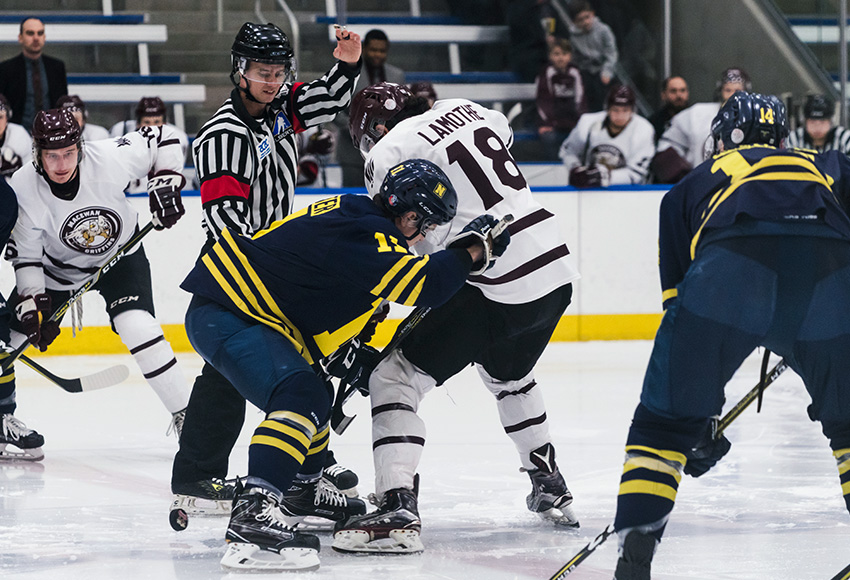 Nakehko Lamothe faces off with NAIT's Thomas Foster during Friday night's 4-1 MacEwan win. NAIT hit back with a 7-1 victory on Saturday (Matthew Jacula photo).