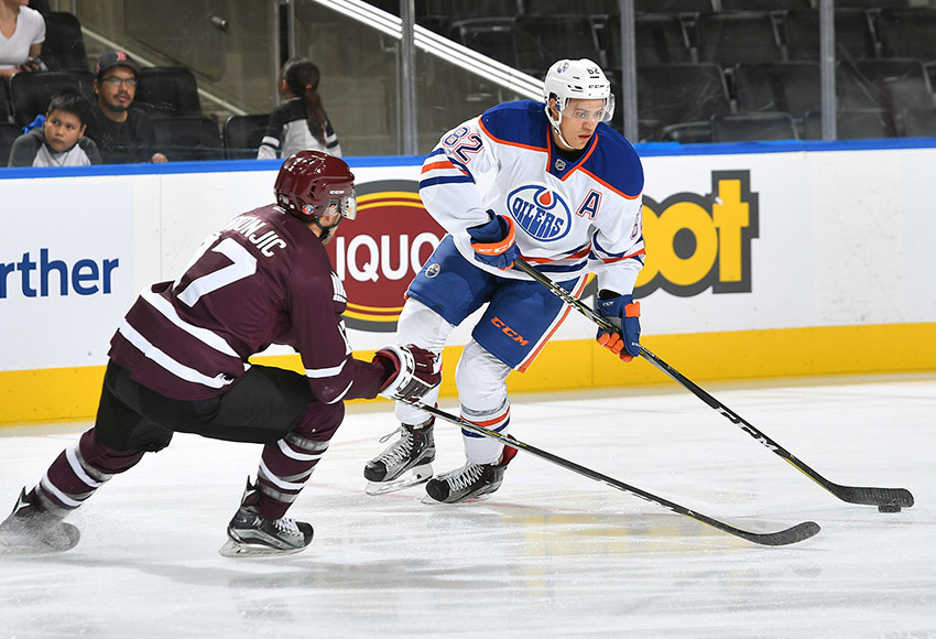 Tyler Mrkonjic goes up against Edmonton Oilers prospect Caleb Jones in the MacEwan-NAIT All-Stars match against the Oilers rookies on Sept. 13 at Rogers Place (Courtesy Edmonton Oilers).