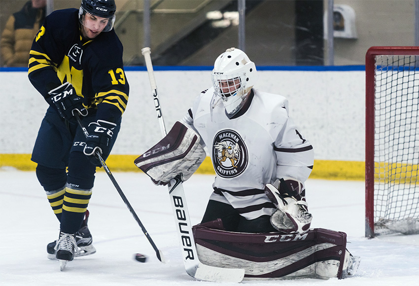 Marc-Olivier Daigle stays in front of an attempted tip by NAIT's Tyler Robertson on Friday night. He made 34 saves to lead MacEwan to a 4-1 win (Matthew Jacula photo).