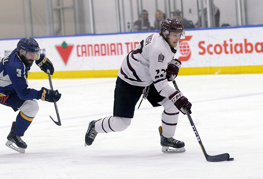 Sean MacTavish leaves Concordia's David Randall in his dust as he goes in alone on a breakaway during a game last weekend (Len Joudrey photo).