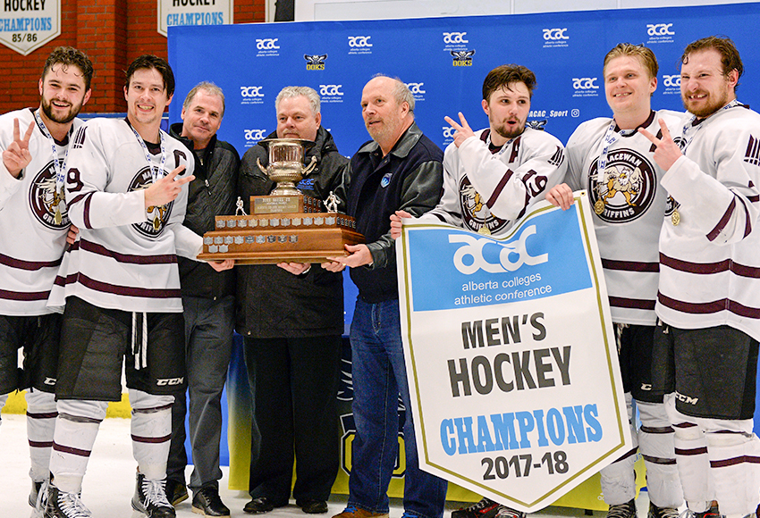 The Griffins men's hockey leadership group of Brett Njaa, left, Ryan Benn, Cam Gotaas, Taylor Bilyk and Nolan Yaremchuk accept the banner and trophy at NAIT Arena on Sunday night - their second-straight ACAC Championship (Len Joudrey photo).
