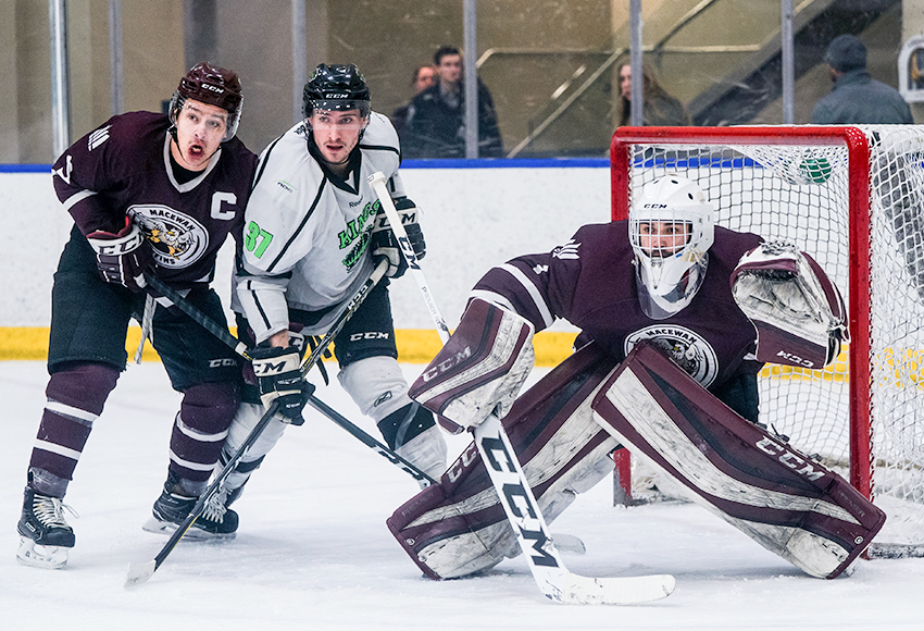 Griffins goaltender Marc-Olivier Daigle stares down a Red Deer College shooter with teammate Ryan Benn and Kings forward Tyrell Mappin in front of the net. Daigle was outstanding, making 33 saves to lead MacEwan to a 4-1 win (Matthew Jacula photo).