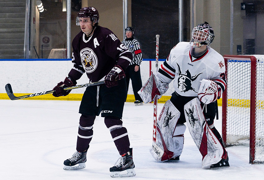 Ryan Baskerville screens UAlberta-Augustana goalie Zach deGraves during a game last weekend. He has 14 points in the first 10 games of the ACAC season for MacEwan (Matthew Jacula photo).