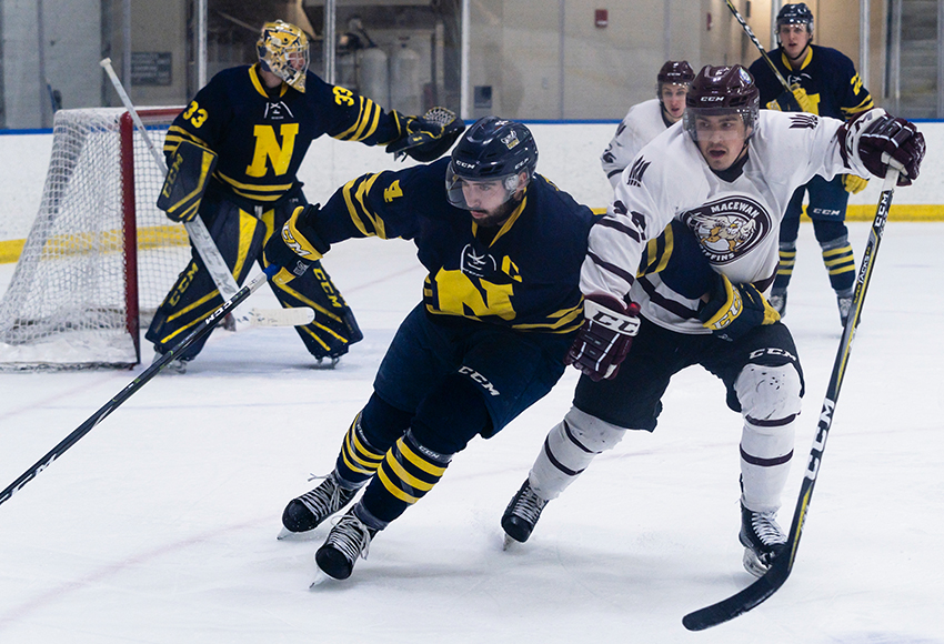 Kaelan Holt battles against Colton Waltz during Friday's meeting between MacEwan and NAIT. The Griffins took three of four possible points against the Ooks to clinch second place in the ACAC standings (Matthew Jacula photo).